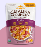 A package of Catalina Crunch protein cereal in Fruity flavor. The packaging is white with purple and pink accents, and it highlights the cereal's nutritional benefits, including 11g of protein and 0g of sugar.