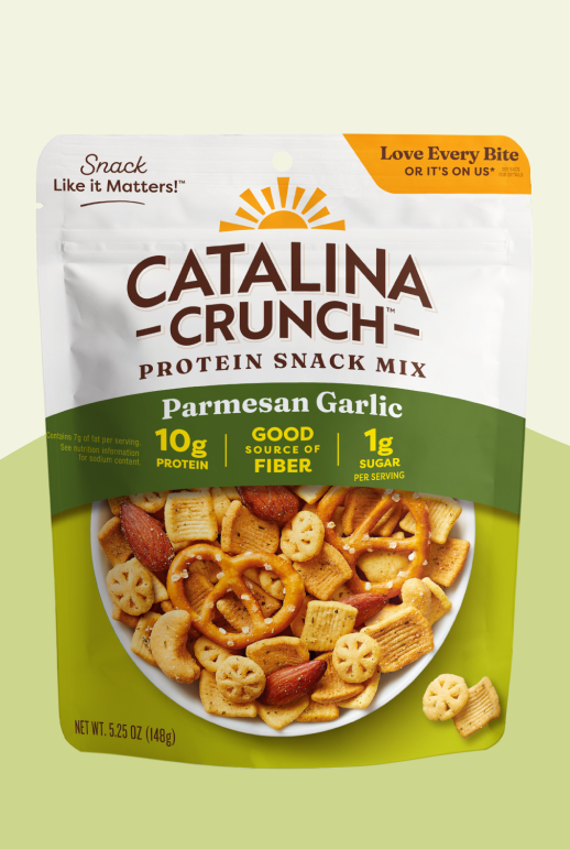 Catalina Crunch Parmesan Garlic protein snack mix packaging on a light green background