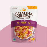 Catalina Crunch Protein Cereal package on a pink background