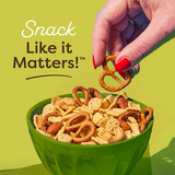 Hand picking a snack from a bowl with 'Snack Like it Matters!' text on a green background