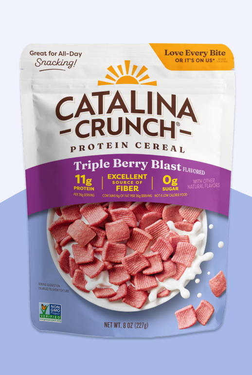 Catalina Crunch Protein Cereal package with triple berry blast flavor on a light blue background